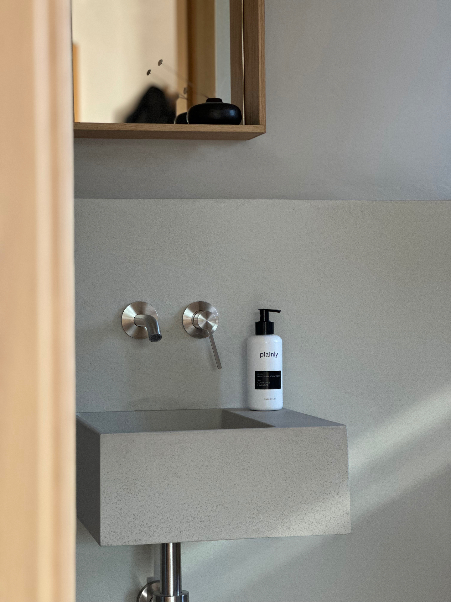 Plainly Hand & Body Wash in a beautifully designed bathroom